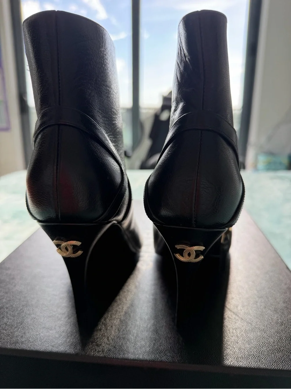 CHANEL Black Leather Ankle Booties with Black Cap Toe and Gold CC